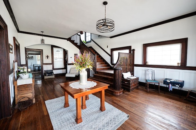 living room with crown molding and dark hardwood / wood-style floors