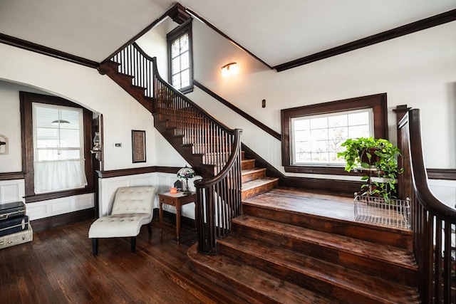 2306 32nd St, Snyder, TX 79549 - stairway with wood-type flooring and crown molding