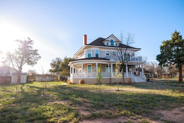2306 32nd St, Snyder, TX 79549 - view of front of property featuring a porch and a front yard