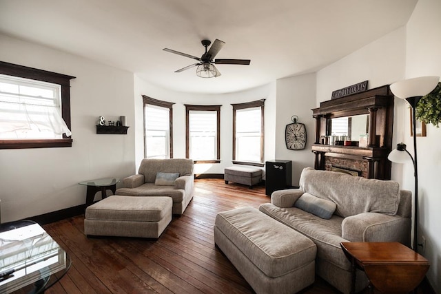 2306 32nd St, Snyder, TX 79549 - living room featuring ceiling fan, plenty of natural light, and dark wood-type flooring