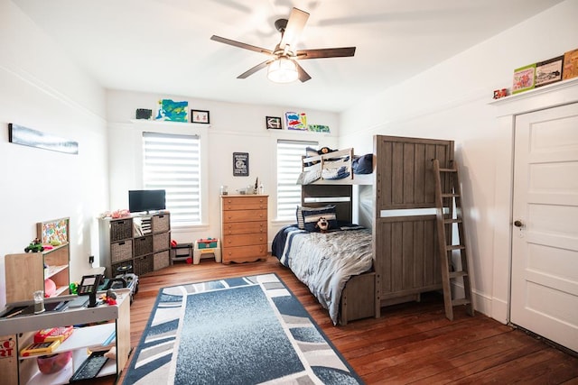 2306 32nd St, Snyder, TX 79549 - bedroom with dark hardwood / wood-style flooring and ceiling fan