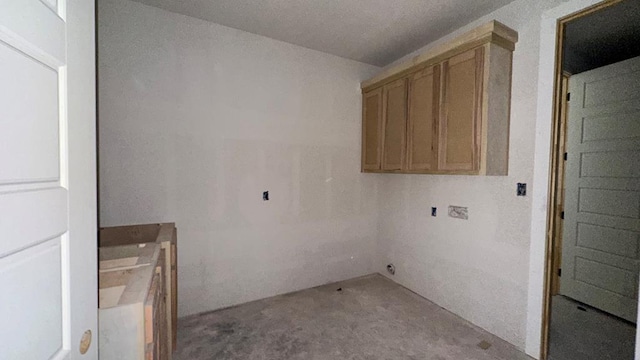 laundry room with a textured ceiling