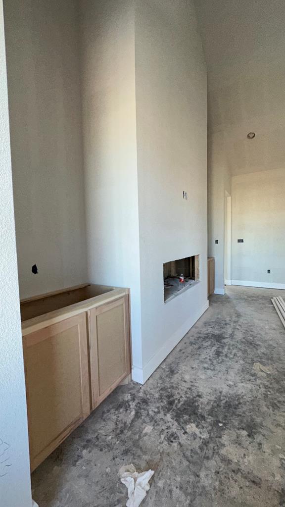 unfurnished living room with carpet