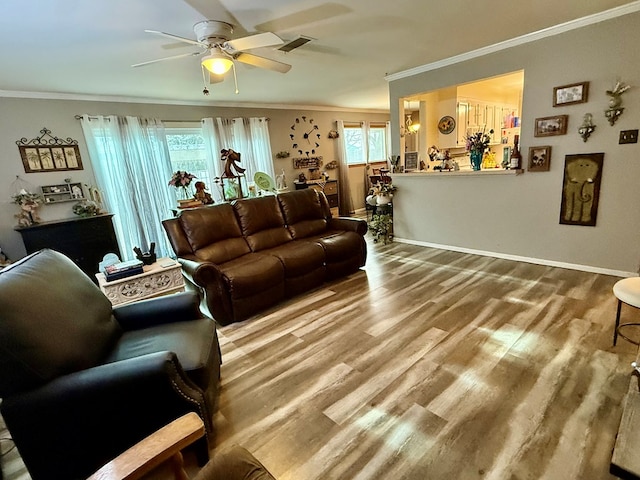 311 Kessler Ave, Midland, TX 79701 - living room featuring crown molding, ceiling fan, baseboards, and wood finished floors