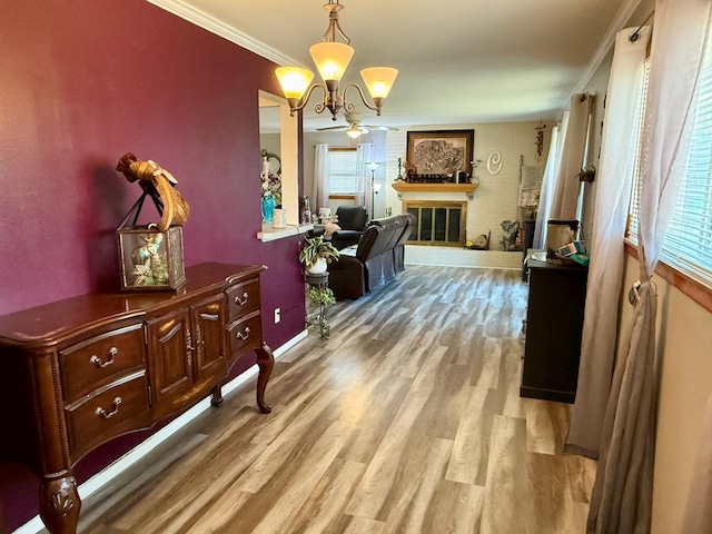 311 Kessler Ave, Midland, TX 79701 - corridor with wood finished floors, a chandelier, baseboards, and crown molding