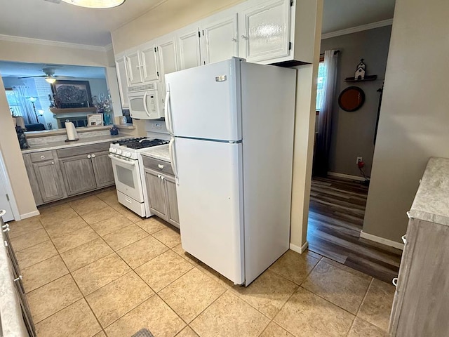 311 Kessler Ave, Midland, TX 79701 - kitchen with white appliances, ornamental molding, light tile patterned floors, light countertops, and a ceiling fan