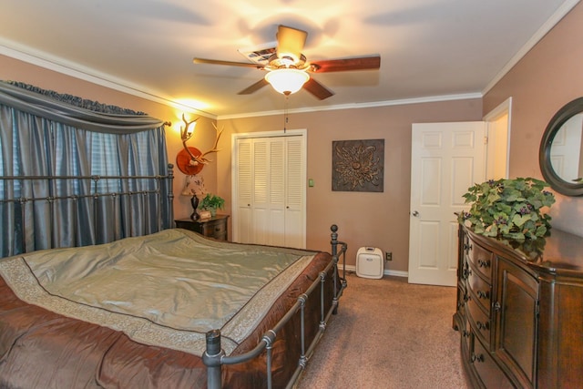 carpeted bedroom featuring crown molding, baseboards, a ceiling fan, and a closet
