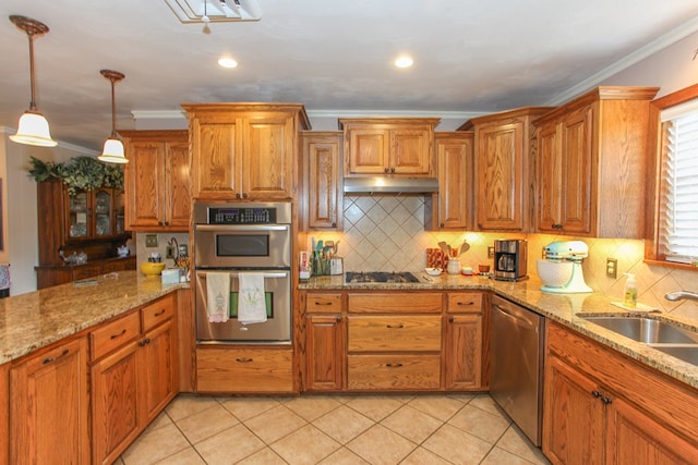 kitchen featuring a sink, stainless steel appliances, brown cabinets, and under cabinet range hood