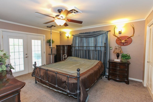 carpeted bedroom featuring visible vents, ornamental molding, ceiling fan, access to outside, and french doors
