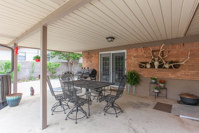 view of patio / terrace featuring fence, outdoor dining space, and area for grilling