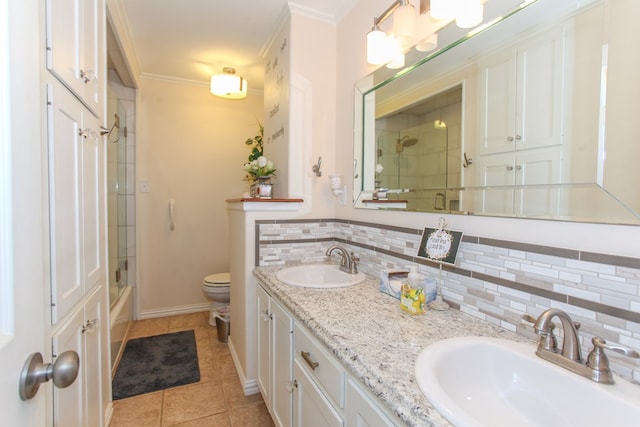 full bathroom featuring an enclosed shower, tile patterned floors, a sink, and tasteful backsplash