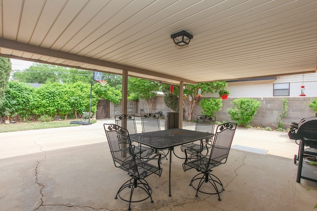 view of patio featuring a fenced backyard and outdoor dining area