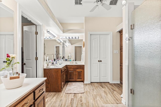 4000 Baybrook Dr, Midland, TX 79707 - full bath with a ceiling fan, vanity, a stall shower, and wood finished floors