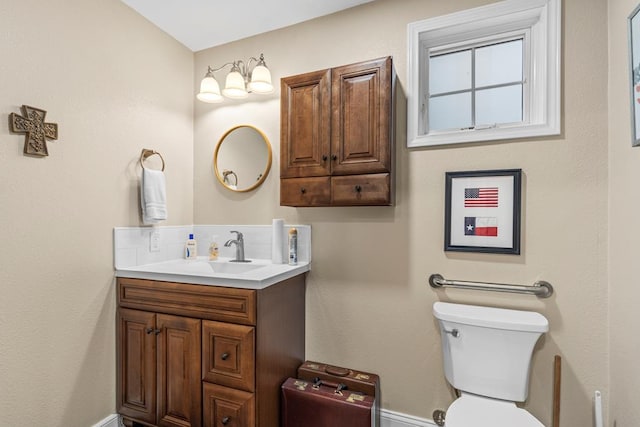 4000 Baybrook Dr, Midland, TX 79707 - bathroom featuring toilet, vanity, and baseboards