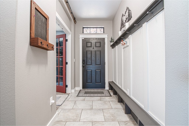 mudroom featuring light tile patterned floors