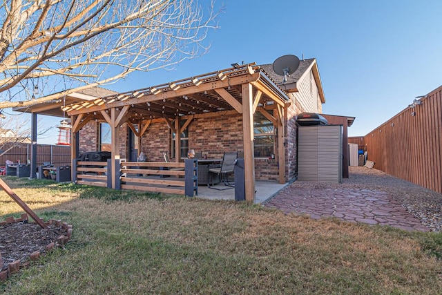 back of property featuring a lawn and a patio