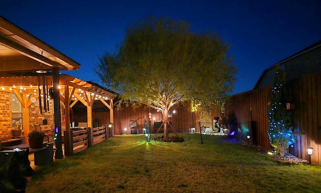 yard at night with a pergola