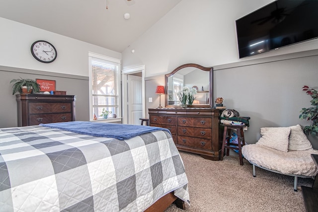 bedroom featuring lofted ceiling and light carpet