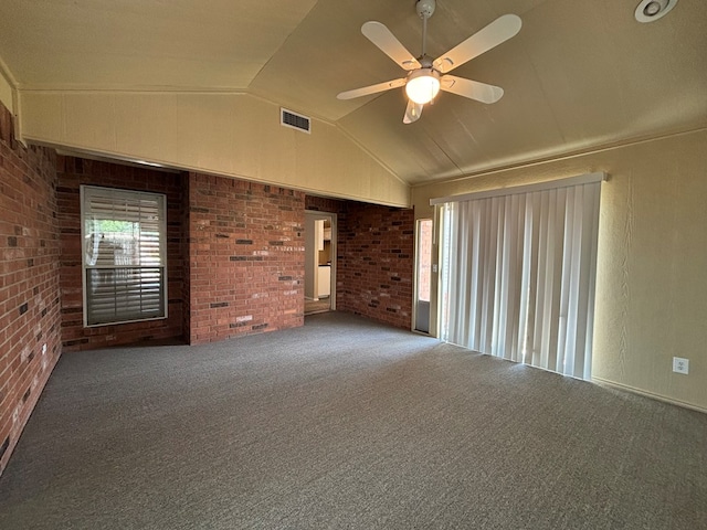 3507 Edgemont Dr, Midland, TX 79707 - carpeted empty room with vaulted ceiling, brick wall, and ceiling fan