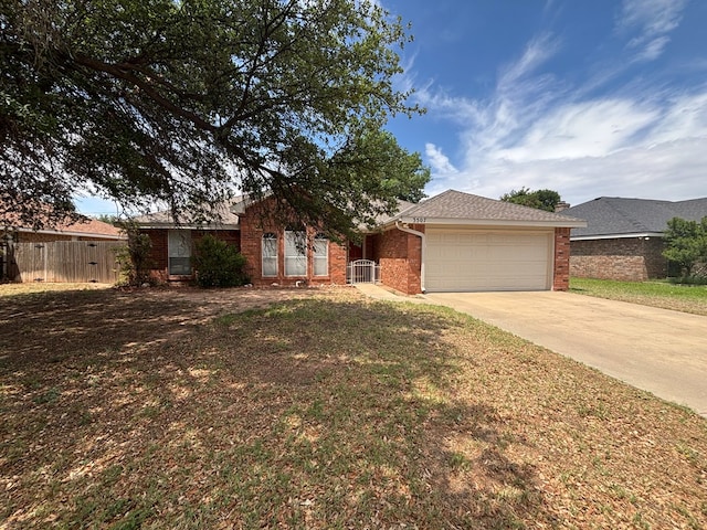3507 Edgemont Dr, Midland, TX 79707 - ranch-style house with brick siding, a garage, and concrete driveway