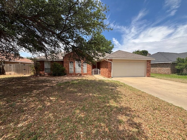 3507 Edgemont Dr, Midland, TX 79707 - single story home featuring brick siding, driveway, and an attached garage