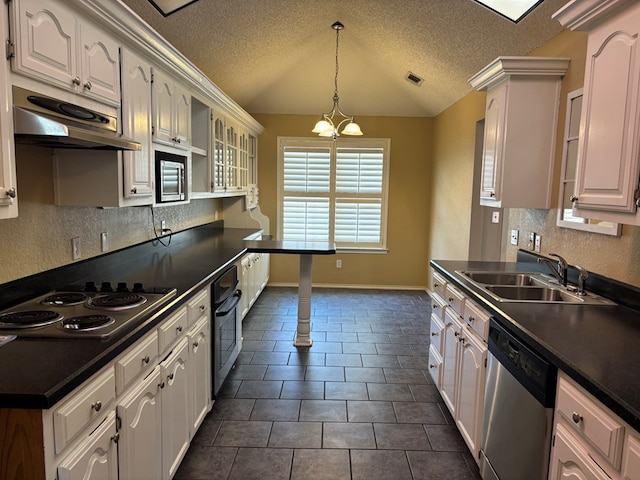 3507 Edgemont Dr, Midland, TX 79707 - kitchen with stainless steel appliances, under cabinet range hood, dark countertops, a textured ceiling, and lofted ceiling