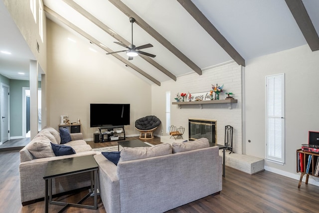 living area featuring a brick fireplace, high vaulted ceiling, dark wood finished floors, and beamed ceiling