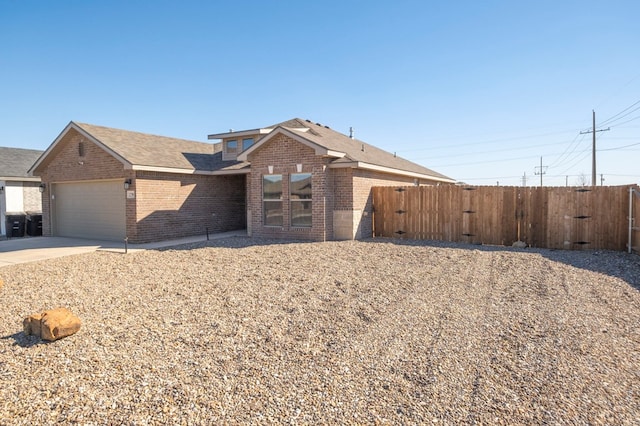 ranch-style home featuring a garage