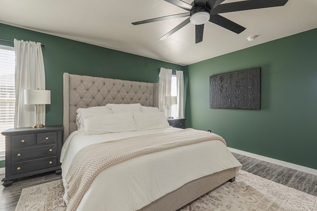 bedroom with hardwood / wood-style flooring and ceiling fan