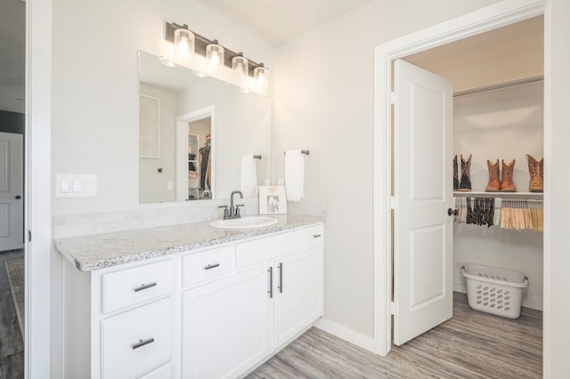 bathroom featuring wood-type flooring and vanity