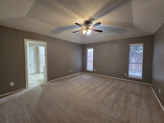 4908 Timber Ct, Midland, TX 79707 - empty room featuring a ceiling fan, light carpet, baseboards, and a textured ceiling