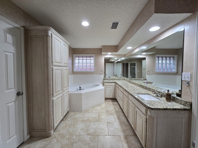 4908 Timber Ct, Midland, TX 79707 - full bathroom with a textured ceiling, a bath, recessed lighting, and vanity