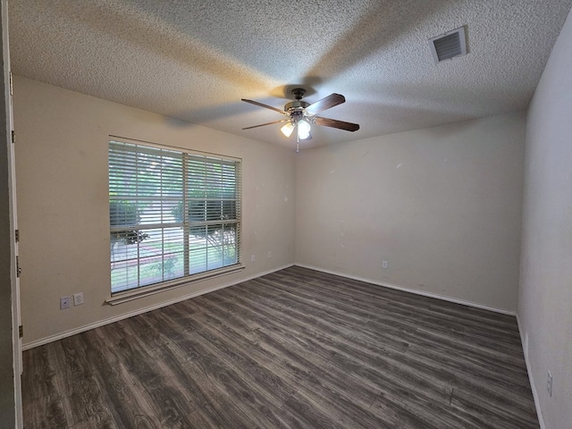 4908 Timber Ct, Midland, TX 79707 - spare room featuring ceiling fan, dark wood-style floors, a textured ceiling, and baseboards
