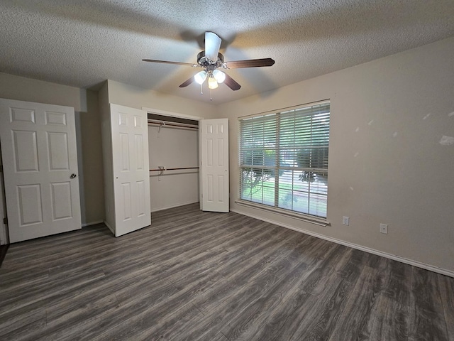 4908 Timber Ct, Midland, TX 79707 - unfurnished bedroom featuring dark wood-style floors, a closet, a textured ceiling, baseboards, and a ceiling fan