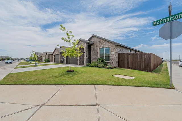 7009 Mcpherson Ln, Midland, TX 79706 - view of front of property with brick siding, concrete driveway, and an attached garage