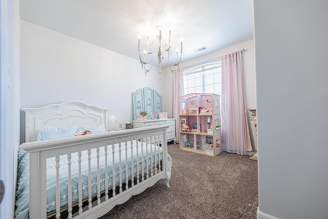 7009 Mcpherson Ln, Midland, TX 79706 - carpeted bedroom with a chandelier and a nursery area