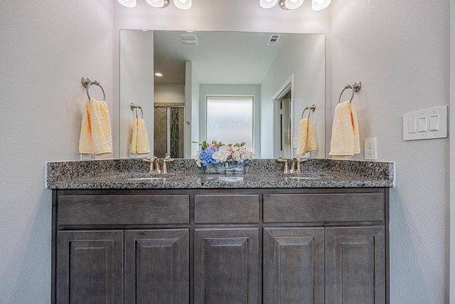7009 Mcpherson Ln, Midland, TX 79706 - full bathroom with double vanity and a shower with shower door