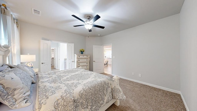 7009 Mcpherson Ln, Midland, TX 79706 - bedroom with carpet, baseboards, ensuite bathroom, and a ceiling fan