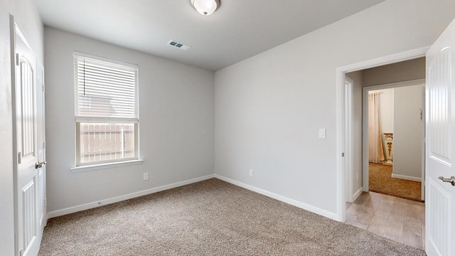 7009 Mcpherson Ln, Midland, TX 79706 - spare room with light colored carpet and baseboards