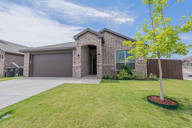 7009 Mcpherson Ln, Midland, TX 79706 - view of front facade with brick siding, a garage, and driveway