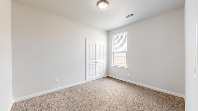 7009 Mcpherson Ln, Midland, TX 79706 - carpeted empty room with baseboards