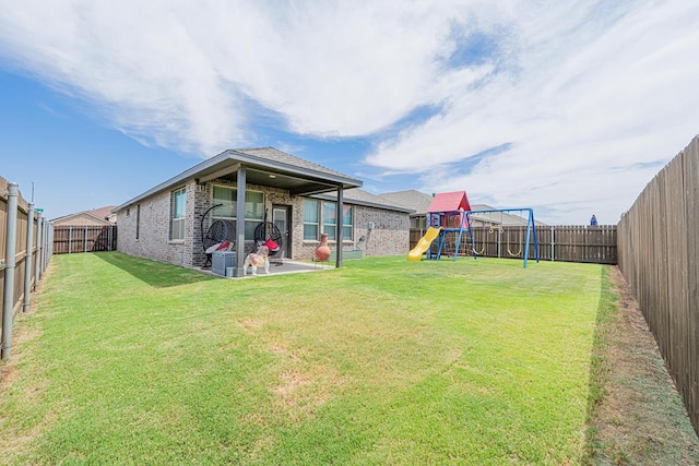 7009 Mcpherson Ln, Midland, TX 79706 - view of yard with a patio area and a playground