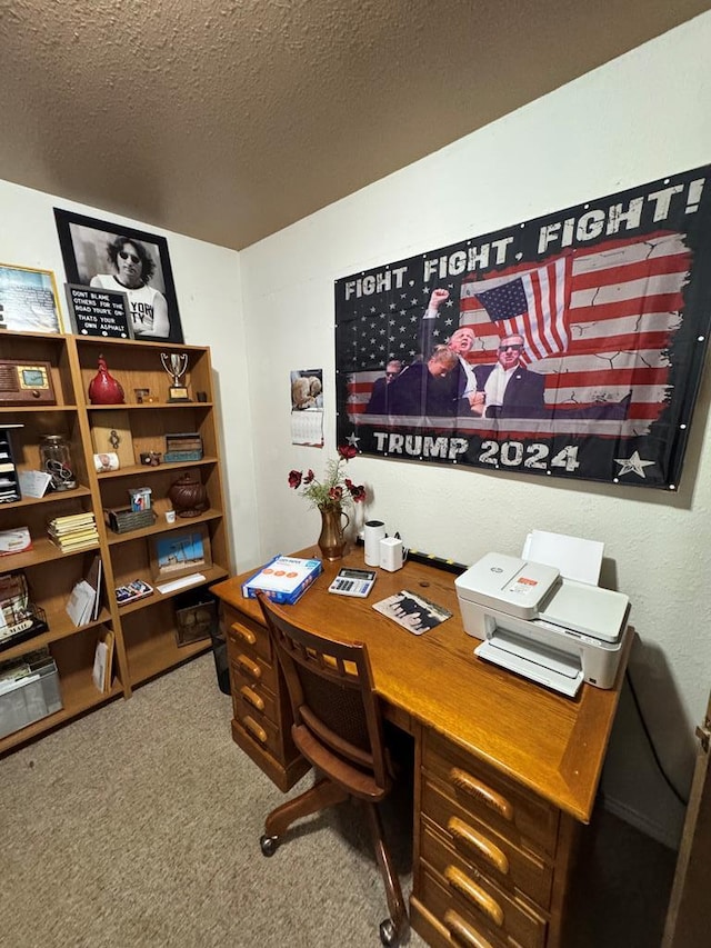 office area with carpet and a textured ceiling