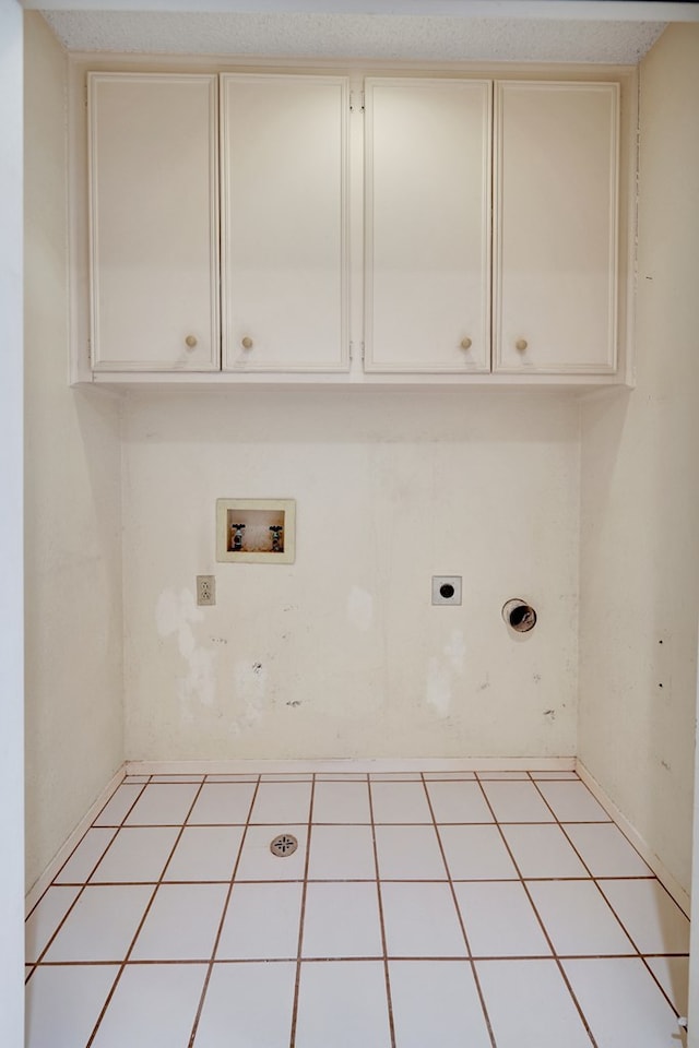 laundry area with cabinets, washer hookup, and hookup for an electric dryer