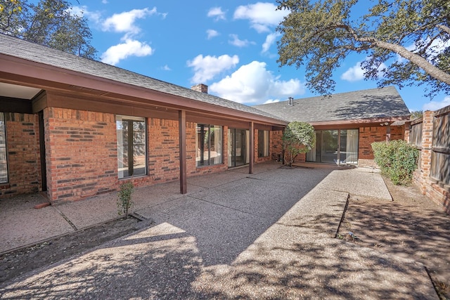 back of property with a patio area