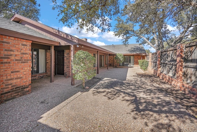 back of house with a patio