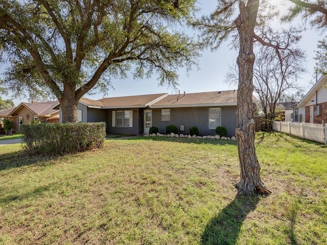 ranch-style home featuring a front yard