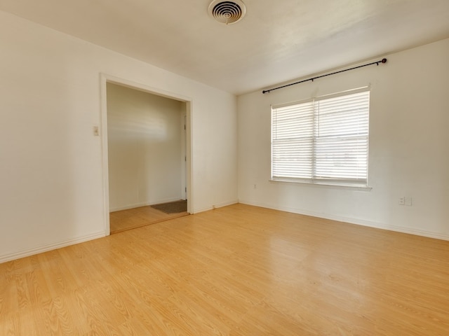 unfurnished room with light hardwood / wood-style floors