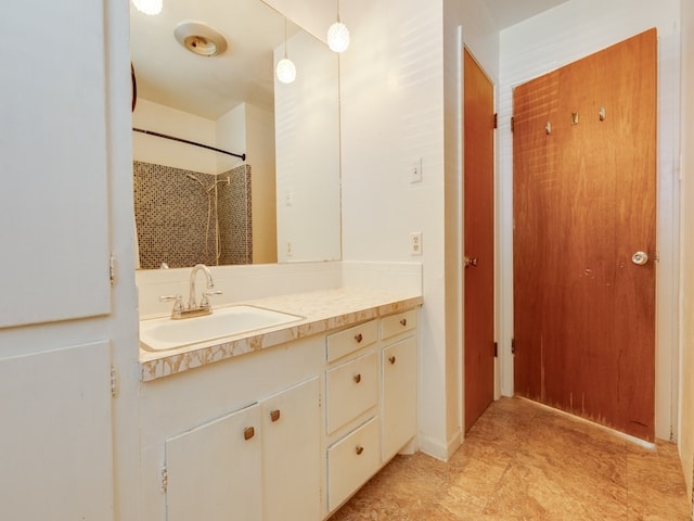 bathroom with vanity and walk in shower