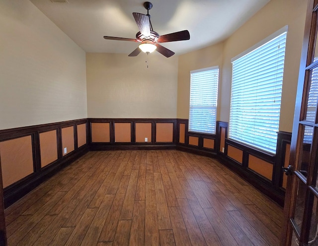 unfurnished room featuring ceiling fan and dark hardwood / wood-style flooring